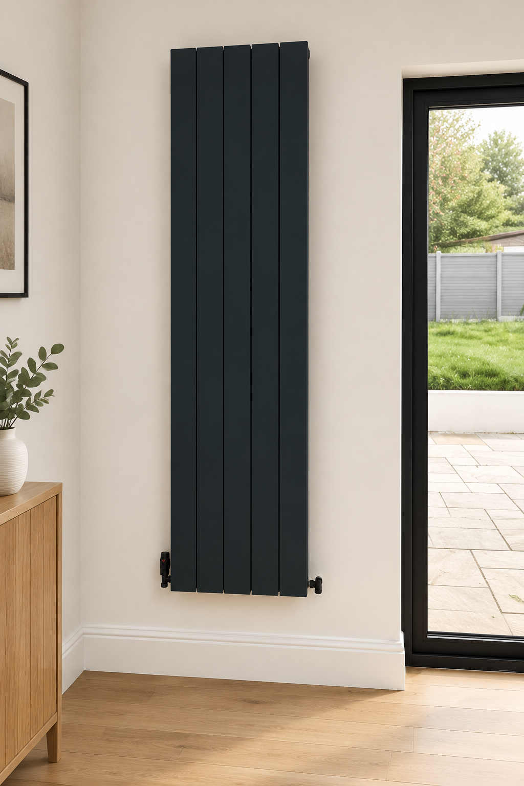 Designer Infinity 1800 x 466 aluminium vertical radiator installed beside a patio door in a modern interior